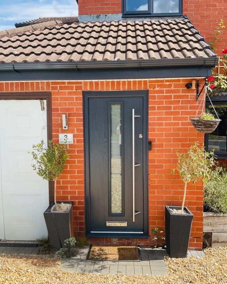 Brick house with a new composite front door and windows